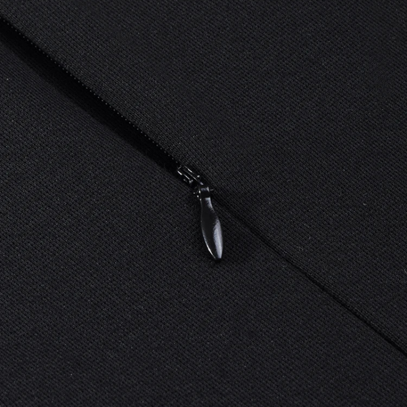 Elegant black midi dress with asymmetrical buttoned collar and fitted silhouette, versatile for office to evening wear. Closeup zipper. 