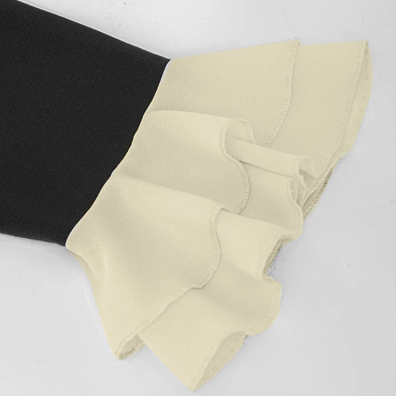 Elegant black office sheath dress with cream bow tie at the neck and matching flared sleeve cuffs, fitted silhouette for work or evening wear.