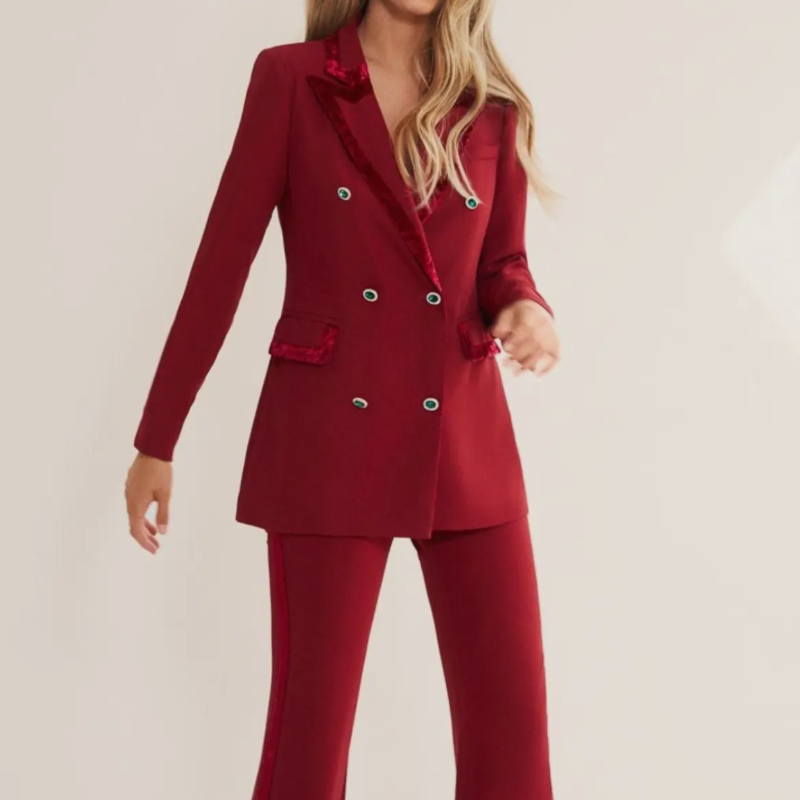 Burgundy cherry red matching velvet piping, tuxedo style, cut silhouette at the waist. Hook-and-eye closure and concealed zip on the back.