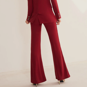 Burgundy cherry red matching velvet piping, tuxedo style, cut silhouette at the waist. Hook-and-eye closure and concealed zip on the back.