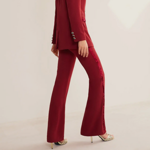 Burgundy cherry red matching velvet piping, tuxedo style, cut silhouette at the waist. Hook-and-eye closure and concealed zip on the back. 