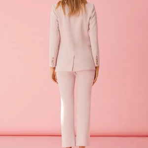 Collarless blush blazer with gold medallion buttons. Chic and stylish blazer pant suit in classic cut