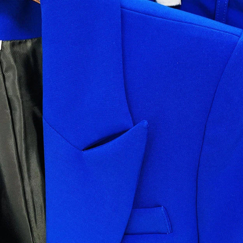 Bright cobalt royal  blue women’s pantsuit with structured blazer and flared trousers, tailored for a bold professional look.