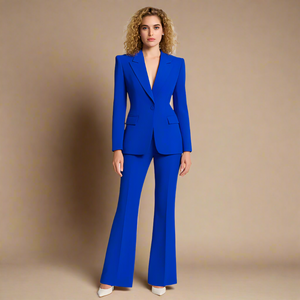 Bright cobalt royal blue women’s pantsuit with structured blazer and flared trousers, tailored for a bold professional look.