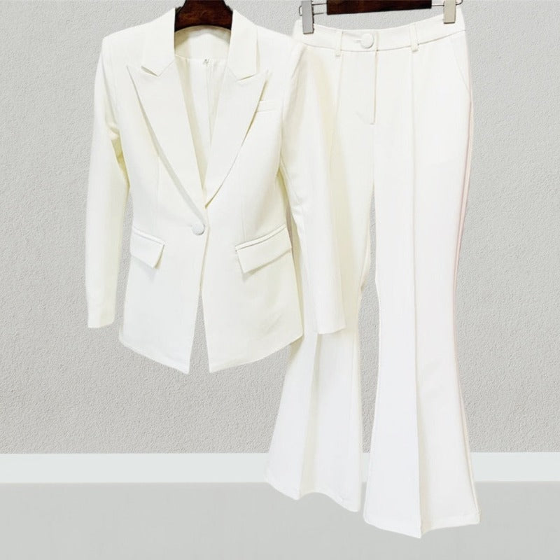 Bold and powerful woman's pant suit in bold crips white. Tailored cut flattering the curves while still being professional and conservative enough for any business meeting or the office.