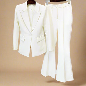 Bold and powerful woman's pant suit in bold crisp white. Tailored cut flattering the curves while still being professional and conservative enough for any business meeting or the office.