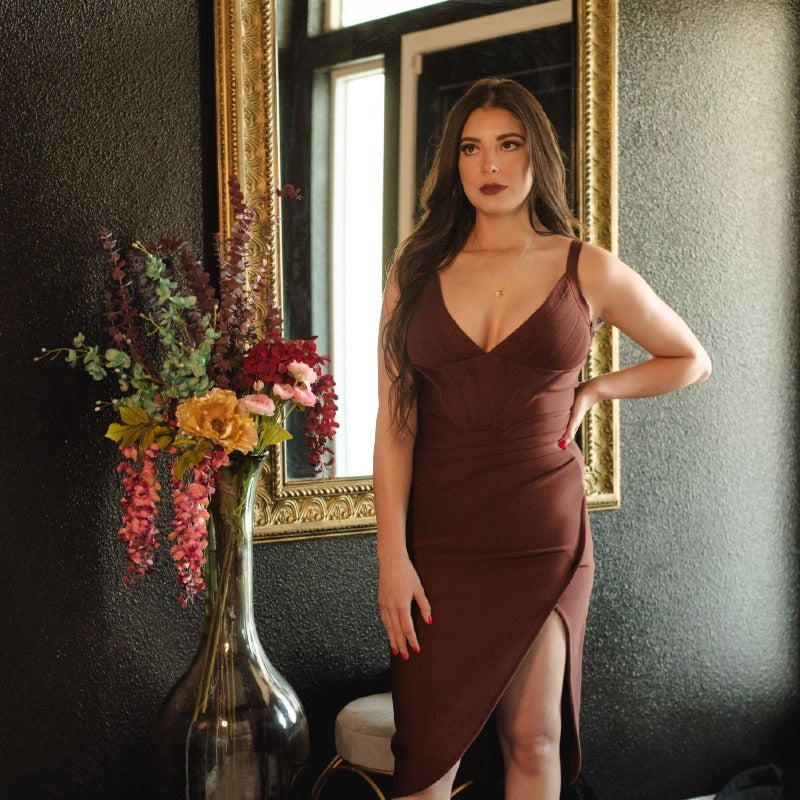 Sexy and elegant bandage dress with a boning bodice, back zipper closure, spaghetti straps, side-slit and plunging V-Neckline. Available in royal blue, chocolate brown, hunter green, black, lilac purple, white, red, and pink. 