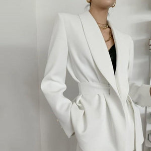 Fashion-forward pant suit with a belted blazer and ankle-tie trousers. Perfect for the office or a night out