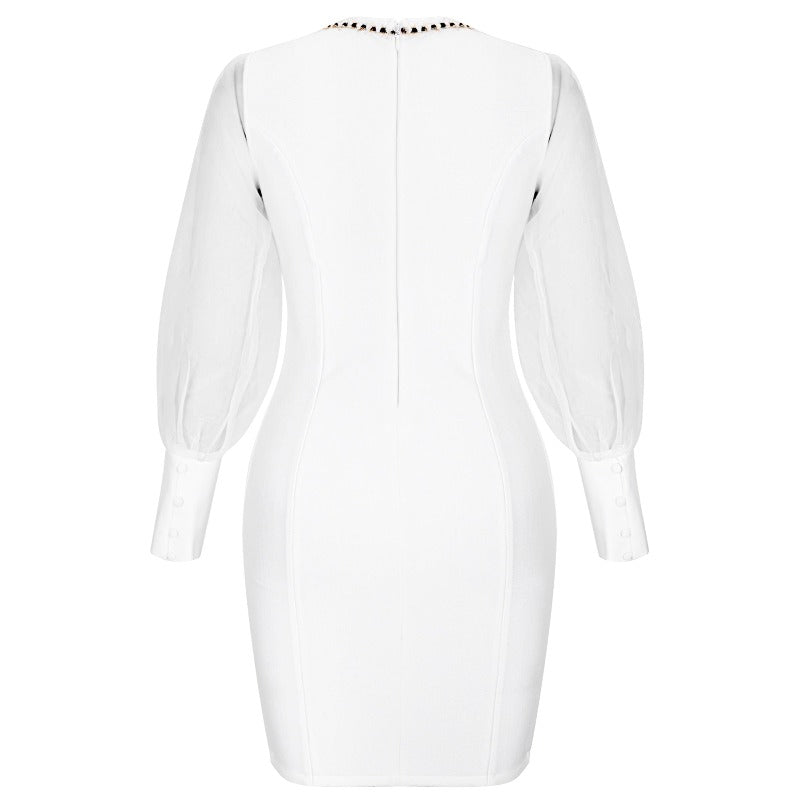 Plus size curvy fashion white bandage dress with mesh sleeves and gold trim and button details. Shapes your curves for a flattering and comfortable fit for any cocktail event, wedding rehearsal, or date night. 