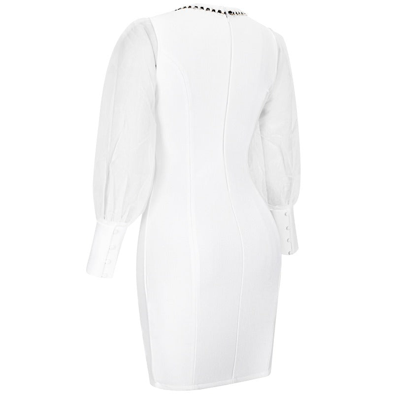 Plus size curvy fashion white bandage dress with mesh sleeves and gold trim and button details. Shapes your curves for a flattering and comfortable fit for any cocktail event, wedding rehearsal, or date night. 